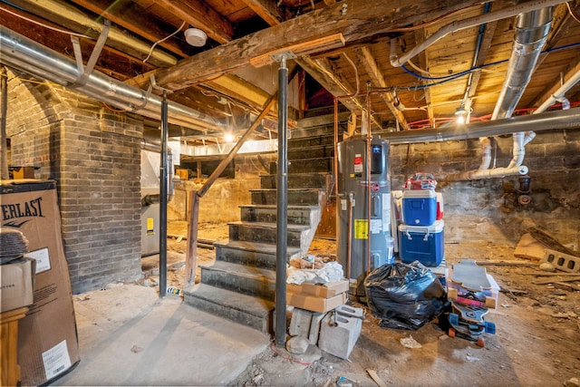 basement with water heater and brick wall