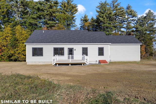 view of front of property with a front lawn and a deck