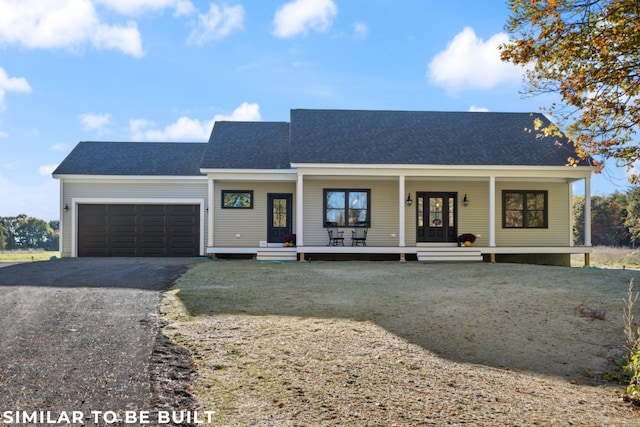 view of front of property with a garage and a porch