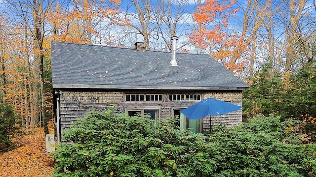 88 Piddock Ln, Fayette, ME 04349 - rear view of house with roof with shingles and a chimney