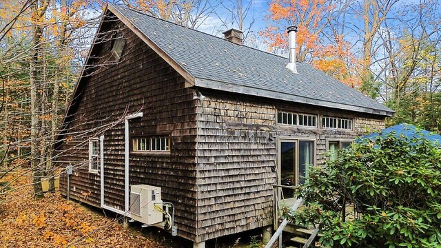 88 Piddock Ln, Fayette, ME 04349 - view of side of home with roof with shingles and a chimney