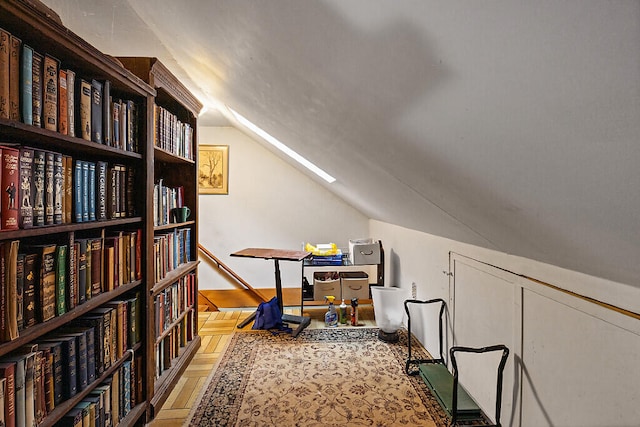 bonus room featuring lofted ceiling and light parquet floors