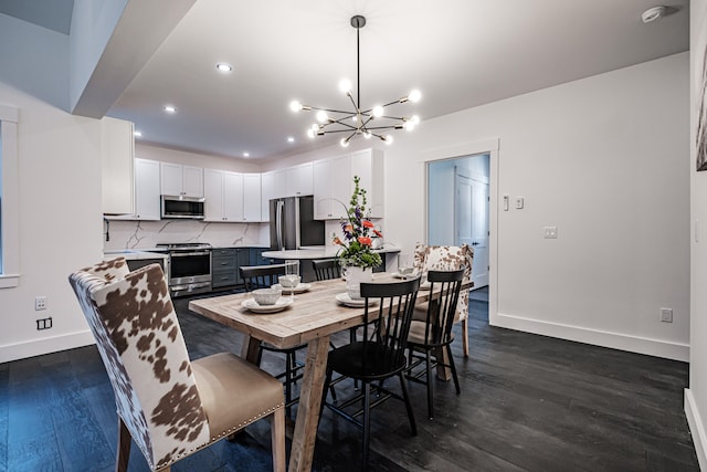 dining room with a notable chandelier and dark hardwood / wood-style flooring