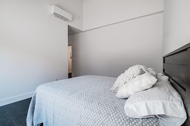 bedroom featuring an AC wall unit