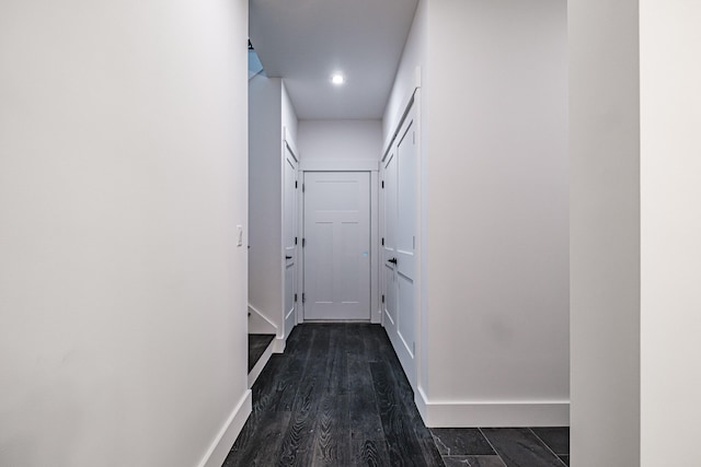 corridor featuring dark wood-type flooring