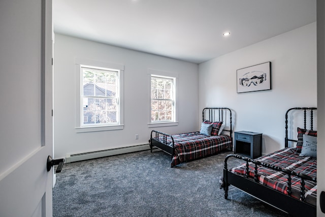 bedroom featuring a baseboard radiator and dark colored carpet