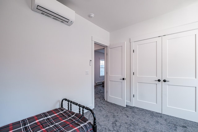 unfurnished bedroom featuring a closet, a wall mounted AC, and carpet floors