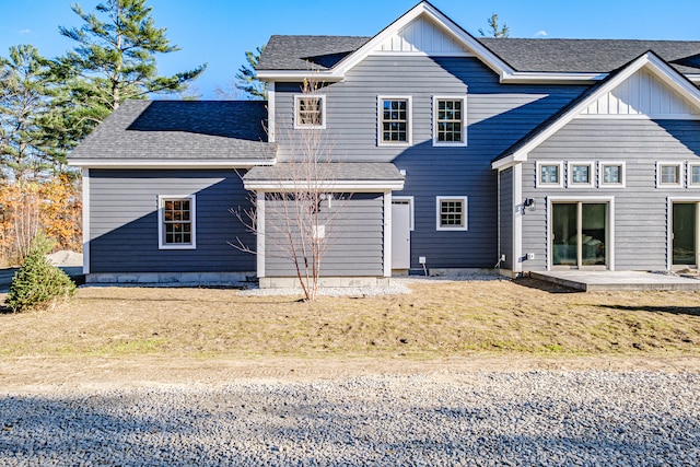 back of house with a patio area and a yard