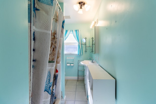 bathroom with vanity, a shower with curtain, and tile patterned flooring