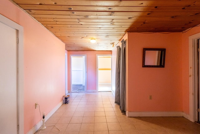 hall featuring wooden ceiling and light tile patterned floors