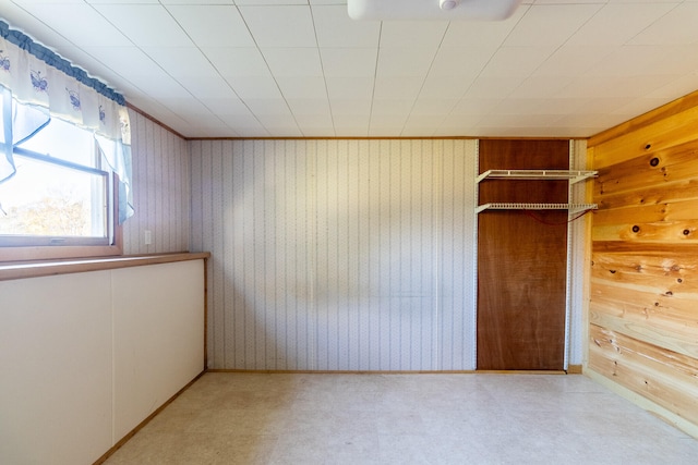 empty room with wood walls