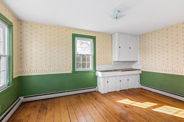 interior space featuring light hardwood / wood-style floors and a baseboard radiator