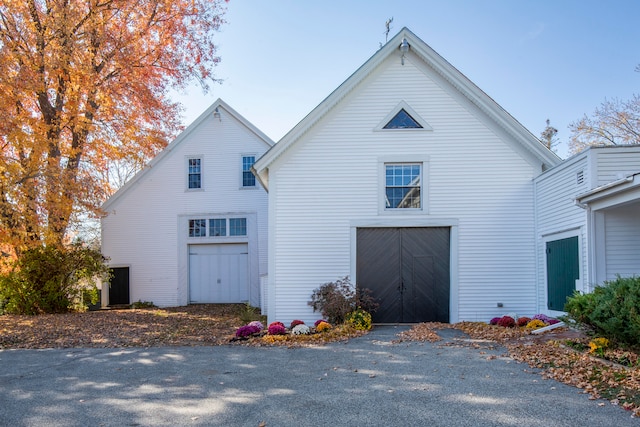 view of side of property featuring a garage