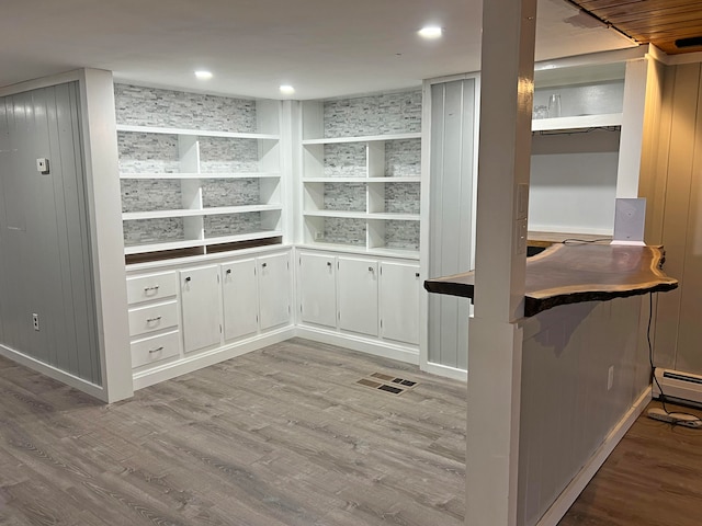 pantry with a baseboard radiator