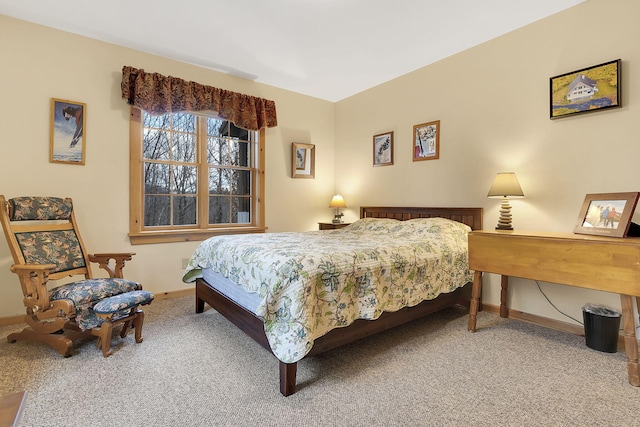 bedroom featuring carpet flooring and baseboards