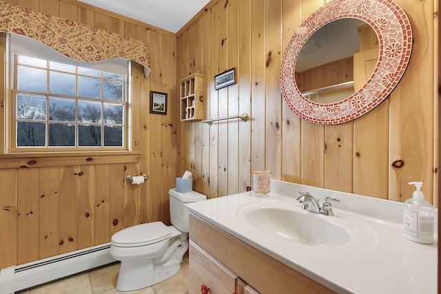 bathroom featuring baseboard heating, tile patterned floors, toilet, wooden walls, and vanity