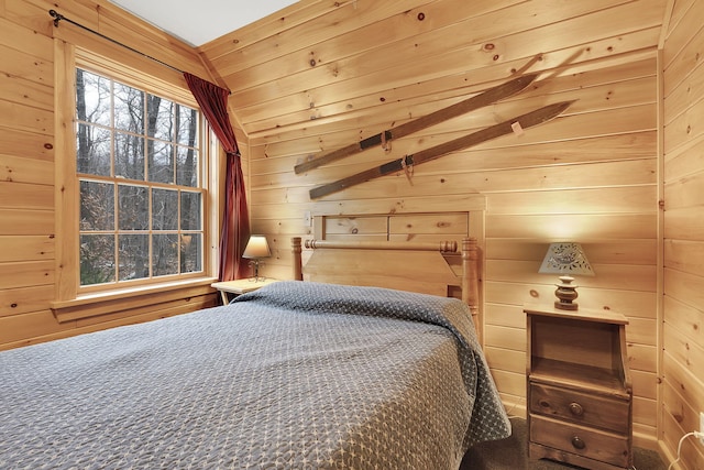 bedroom with lofted ceiling, wooden ceiling, and wooden walls