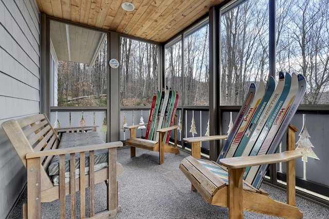 sunroom featuring wood ceiling