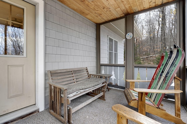 sunroom / solarium featuring healthy amount of natural light