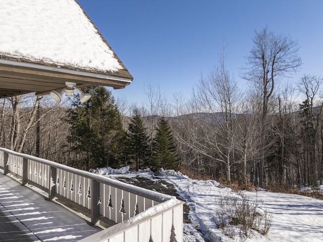 view of snow covered deck