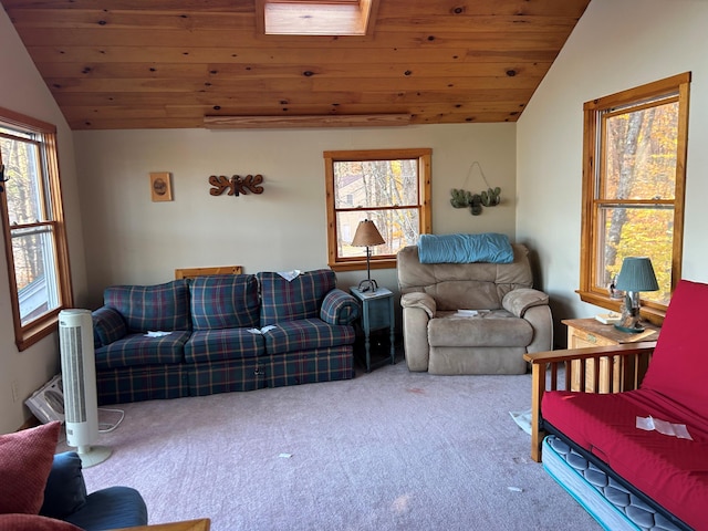 carpeted living room featuring wood ceiling and vaulted ceiling with skylight