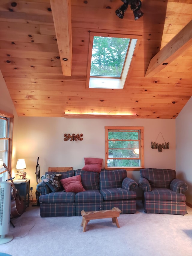 living room featuring vaulted ceiling with skylight, wooden ceiling, and a wealth of natural light