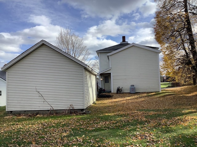 view of side of property with a yard