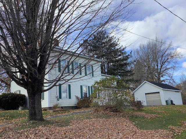 view of property exterior with an outbuilding and a garage