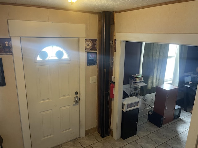 tiled foyer entrance featuring a healthy amount of sunlight