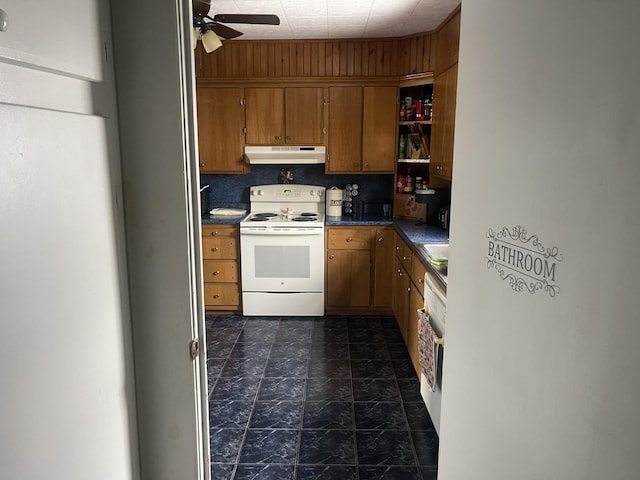 kitchen featuring ceiling fan, sink, and white electric stove