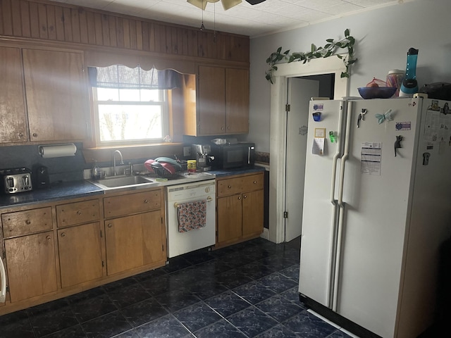 kitchen featuring ceiling fan, white appliances, and sink