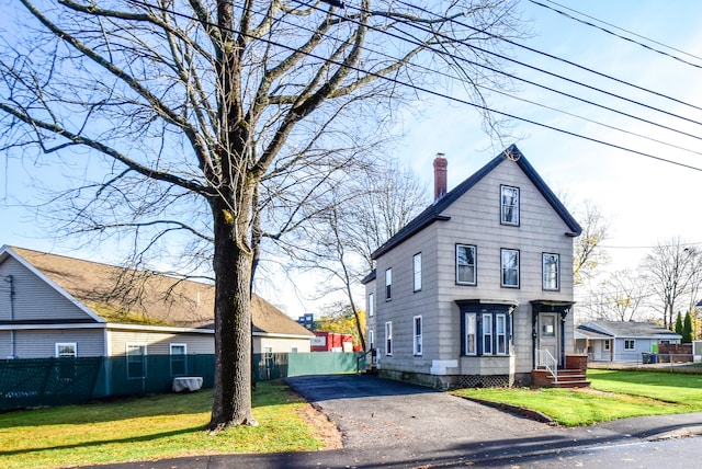 view of front of home with a front yard