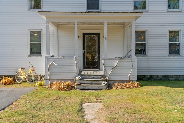 property entrance with a yard