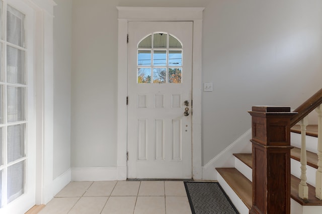 foyer featuring light tile patterned flooring