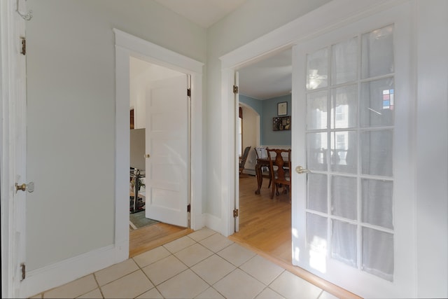 hall with light hardwood / wood-style floors