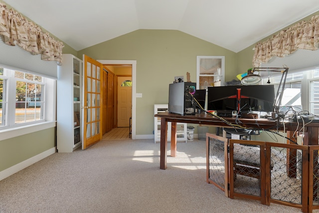 home office featuring vaulted ceiling and light colored carpet