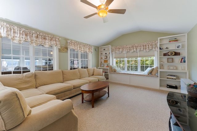 carpeted living room with vaulted ceiling and ceiling fan