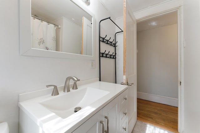 bathroom featuring vanity and wood-type flooring