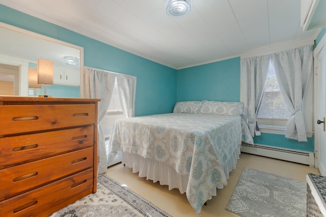 bedroom with ornamental molding and baseboard heating