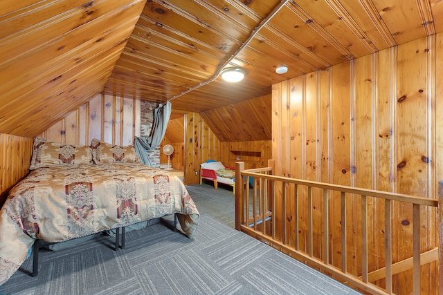 bedroom with wooden walls, vaulted ceiling, wood ceiling, and carpet flooring