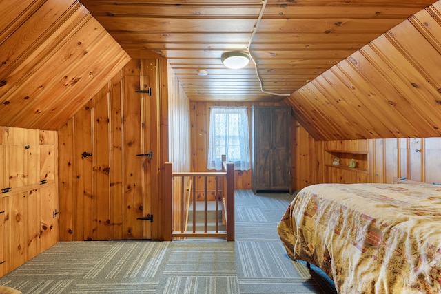 bedroom with wood walls, carpet flooring, vaulted ceiling, and wooden ceiling