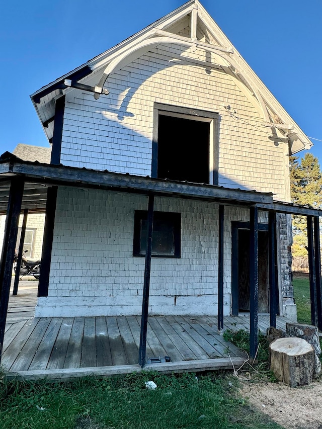 back of property with a wooden deck