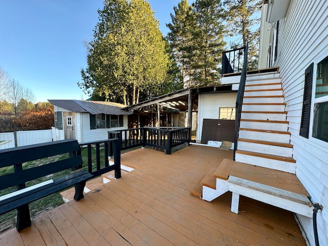 wooden deck with an outbuilding