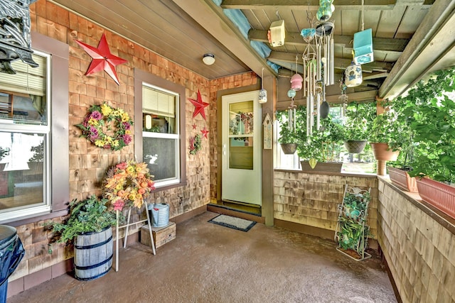 entrance to property featuring covered porch