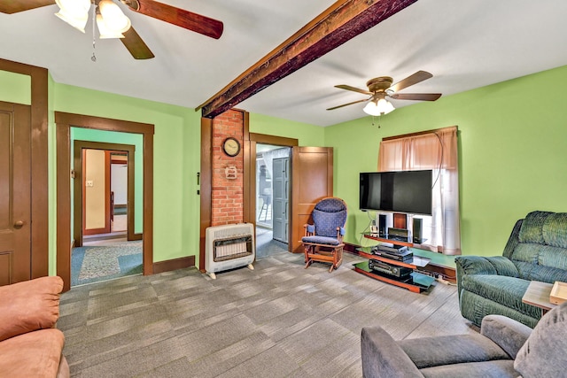 carpeted living area featuring heating unit, a ceiling fan, and beam ceiling