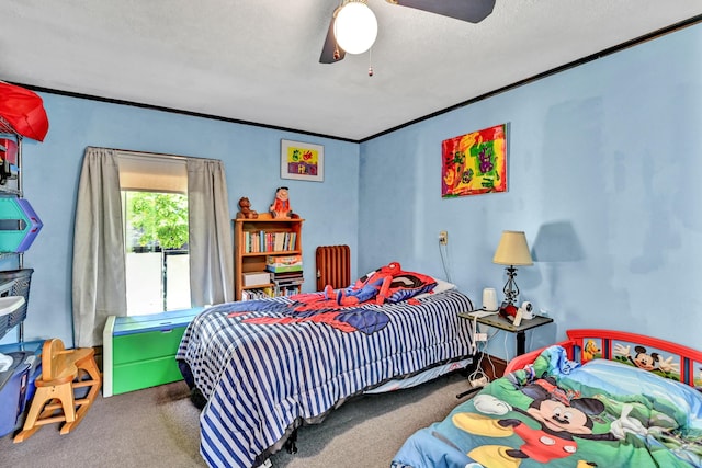 carpeted bedroom with ceiling fan and crown molding