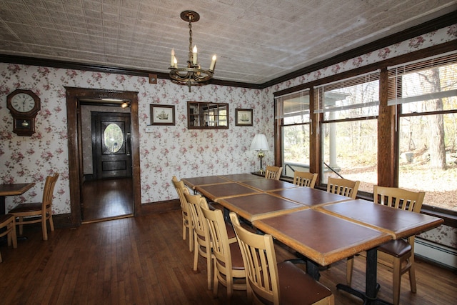 dining space featuring ornamental molding, a chandelier, a baseboard radiator, and dark hardwood / wood-style flooring