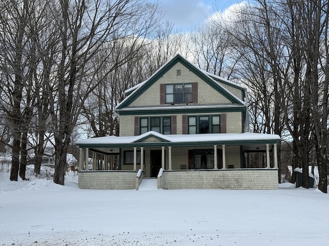 country-style home featuring covered porch