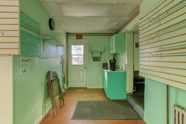 interior space with light hardwood / wood-style flooring and radiator