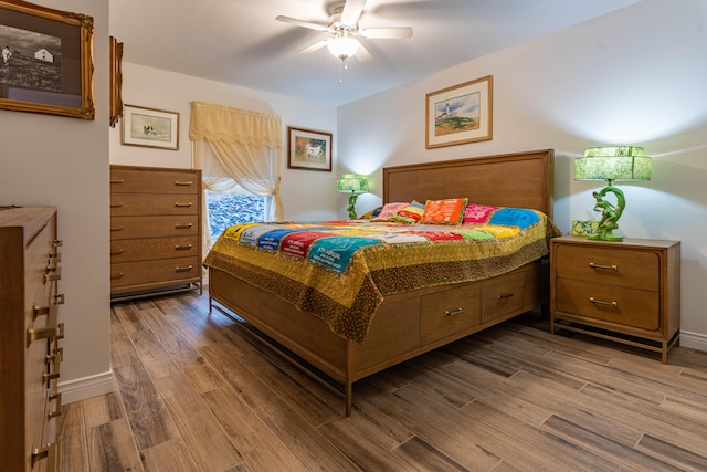 bedroom featuring wood-type flooring and ceiling fan